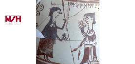 une sc&egrave;ne peinte sur une poterie antique, montrant deux personnages en conversation